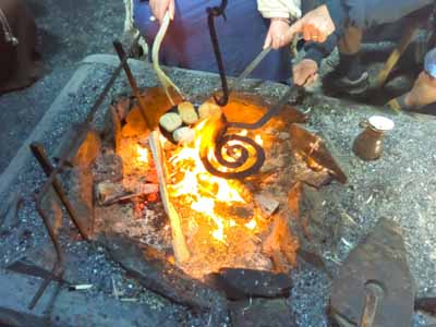 Roasting
        food over the fire