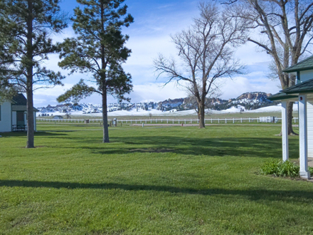 Hills behind fort
        cabins